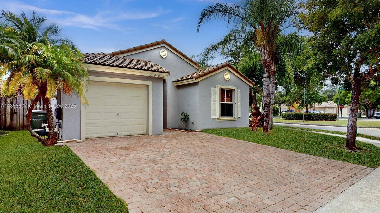 Welcome to this charming 3 bedroom, 2 bathroom, 1 car garage, pool home on a corner lot located in the family friendly gated community in the Shores of Keys Gate.