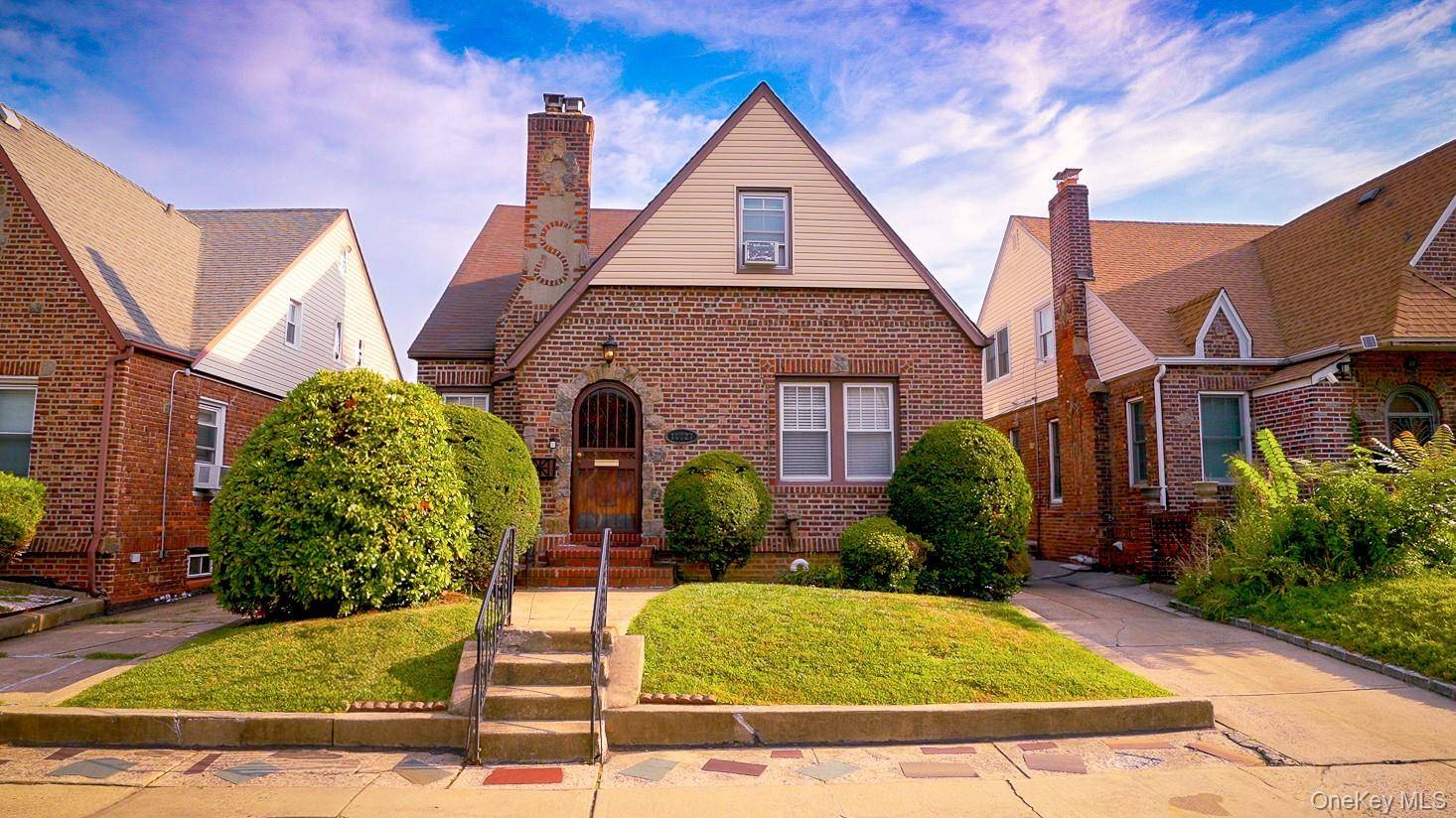 An exquisite Tudor style two family home awaits in the tranquil and desirable neighborhood of Whitestone, Queens.