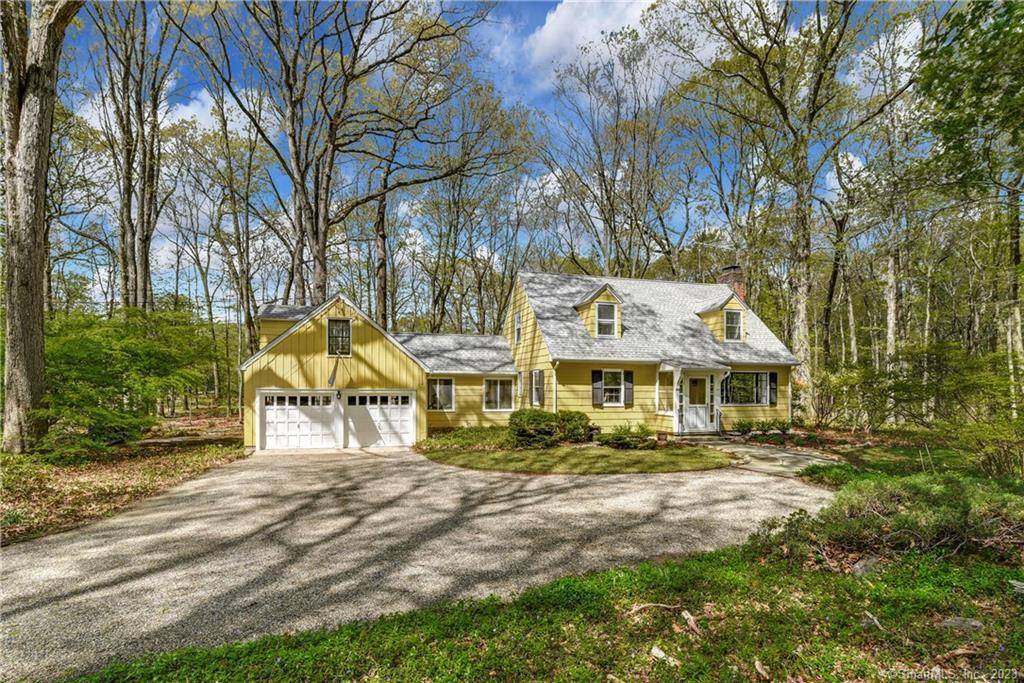 Charming Cape Cod Retreat on 6 Private Wooded Acres Tucked away on six secluded acres of lush woods with a picturesque pond, this charming Cape Cod style home offers the ...