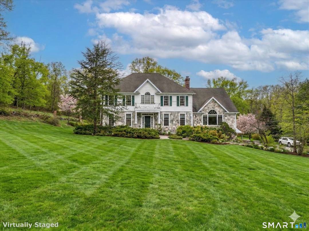 Set on 3 acres, well appointed Colonial Style Home custom built in 1999, offering 3, 802 sq ft and 1, 500 sq ft of fully finished walk out Lower Level.