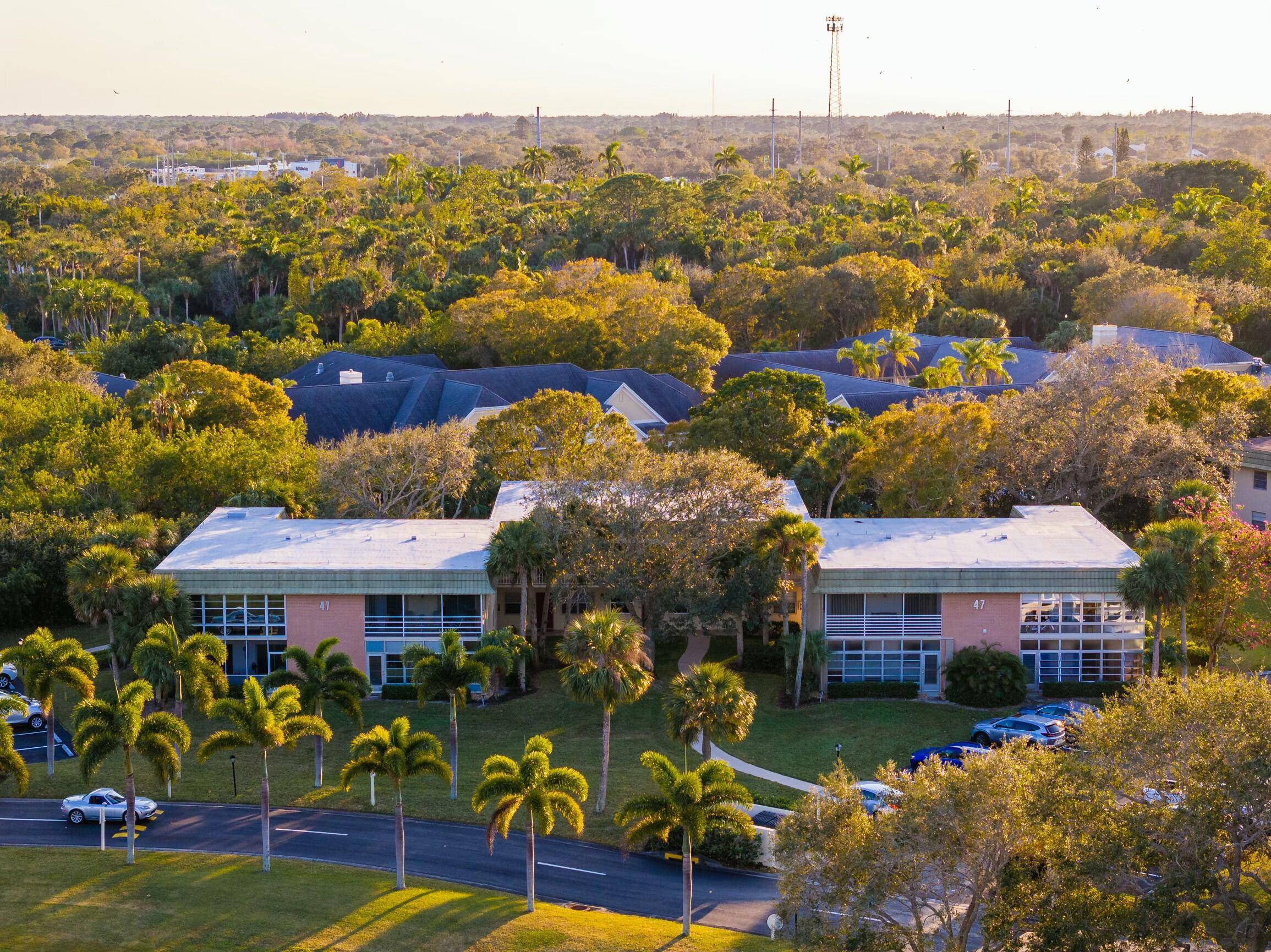 Remarkably renovated 1st floor corner unit located in Vista gardens with a view overseeing one of the golf courses greens.