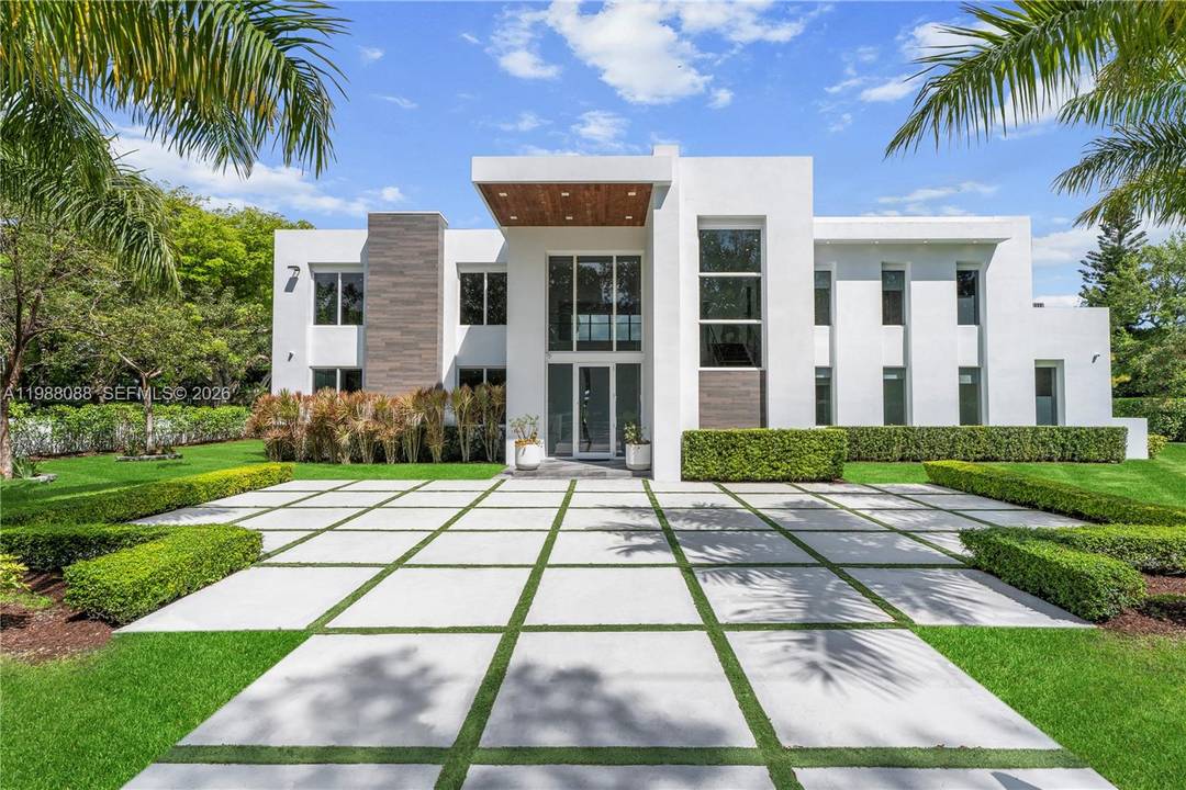 An exceptional gated Pinecrest estate on a corner lot spanning over 37, 000 sqft.