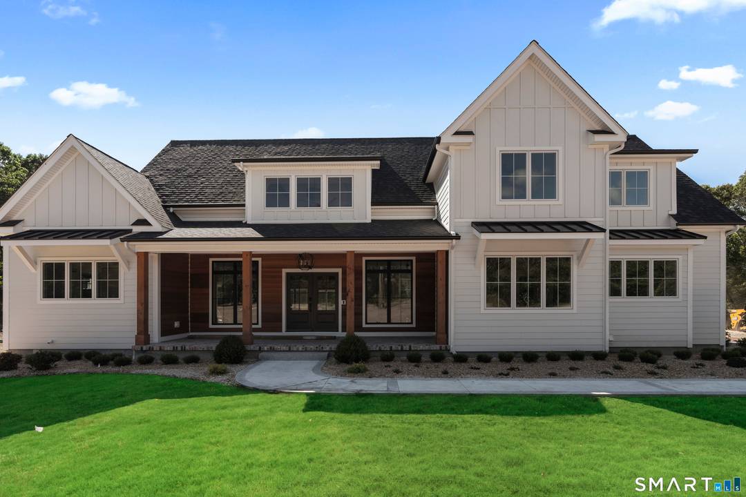 Situated on serene Pattagansett Lake, this to be built five bedroom, three bathroom home offers a luxurious and modern living experience.