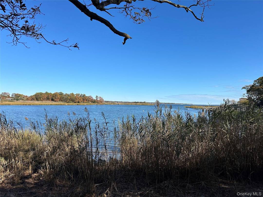 One acre of Waterfront Land overlooking picturesque Reeves Bay with all building, wetland and health department approvals for a 3 bedroom, 3 full bath custom home with a full basement ...