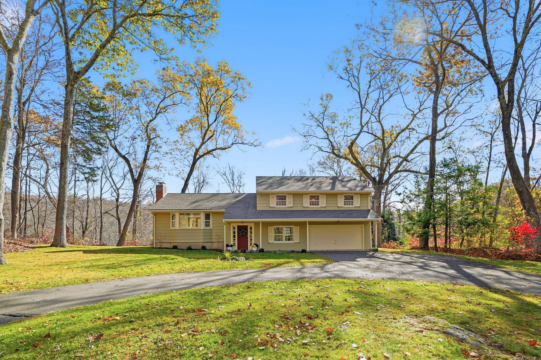 Welcome to 4 Orchard Drive, a charming retreat in the heart of Redding, CT.