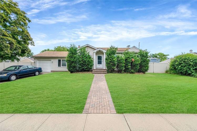 Huge Price Drop Welcome to to this EXTRA large expanded ranch located in the heart of Massapequa.