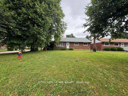 Welcome to this beautifully renovated 5 bedroom home, perfectly situated on a spacious lot with no backyard neighbors and backing directly onto a quiet schoolyard.