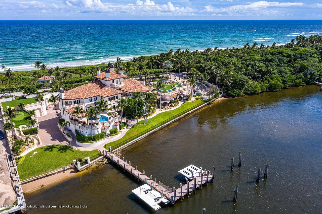 A Palatial Waterfront Estate on over 3 Acres Delivers Every Amenity You Could Want !