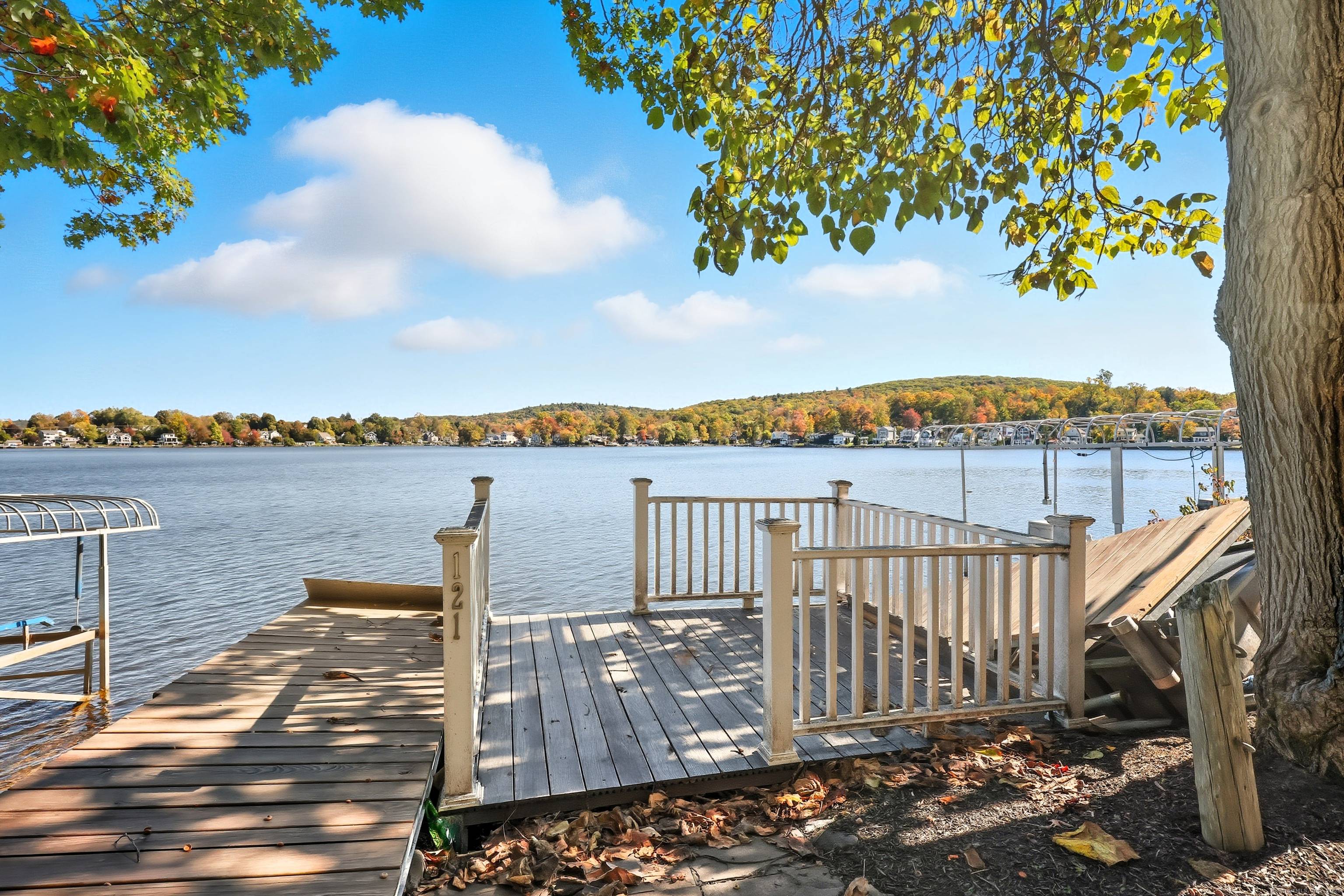 Discover lakeside living at its finest with this renovated 5 bedroom, 4 bath family estate set privately on a full acre overlooking picturesque Highland Lake.