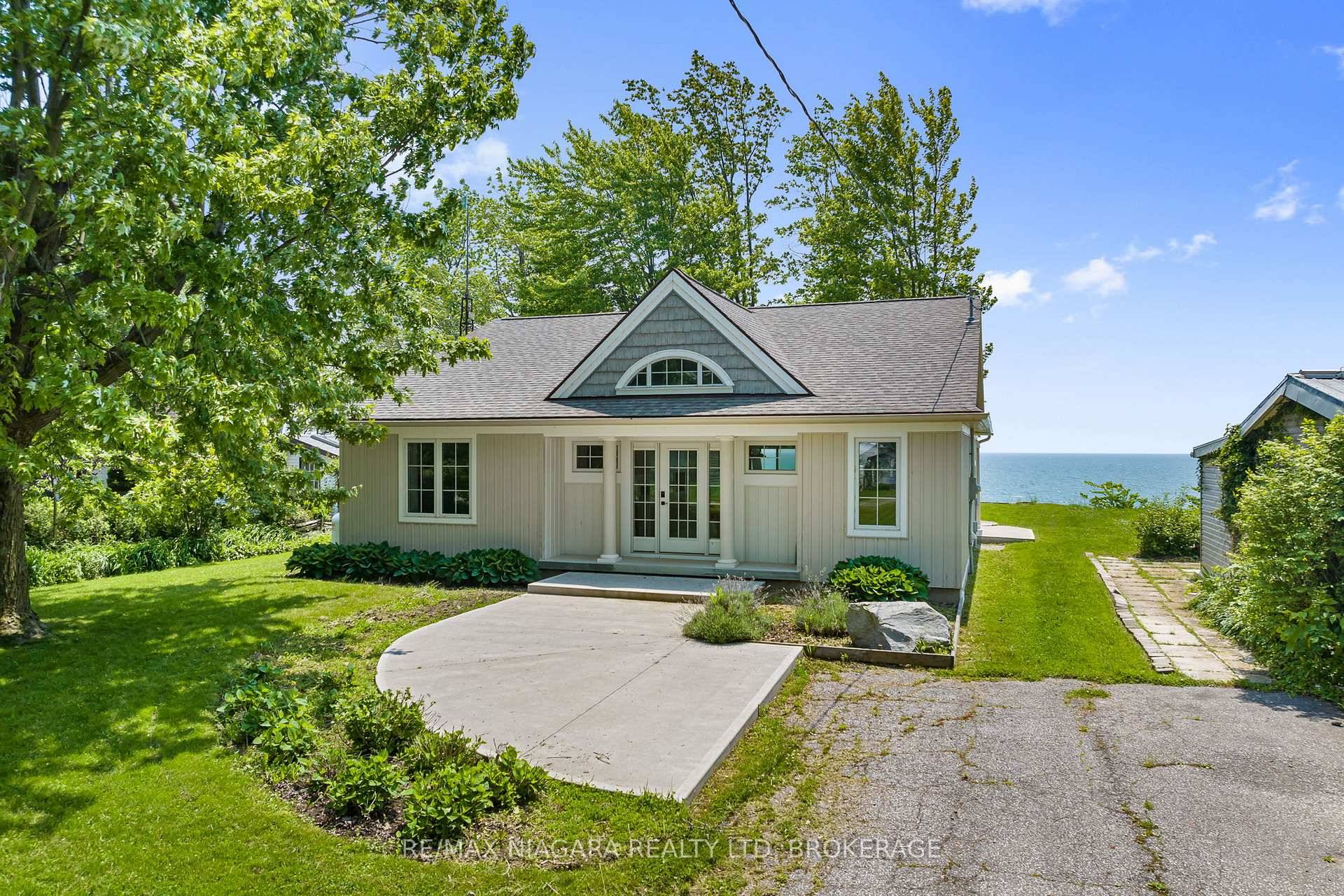 Prepared to be WOWED from the moment you open the door to this amazing waterfront bungalow sitting atop the bluffs overlooking Gull Island, along the shores of beautiful Lake Erie.