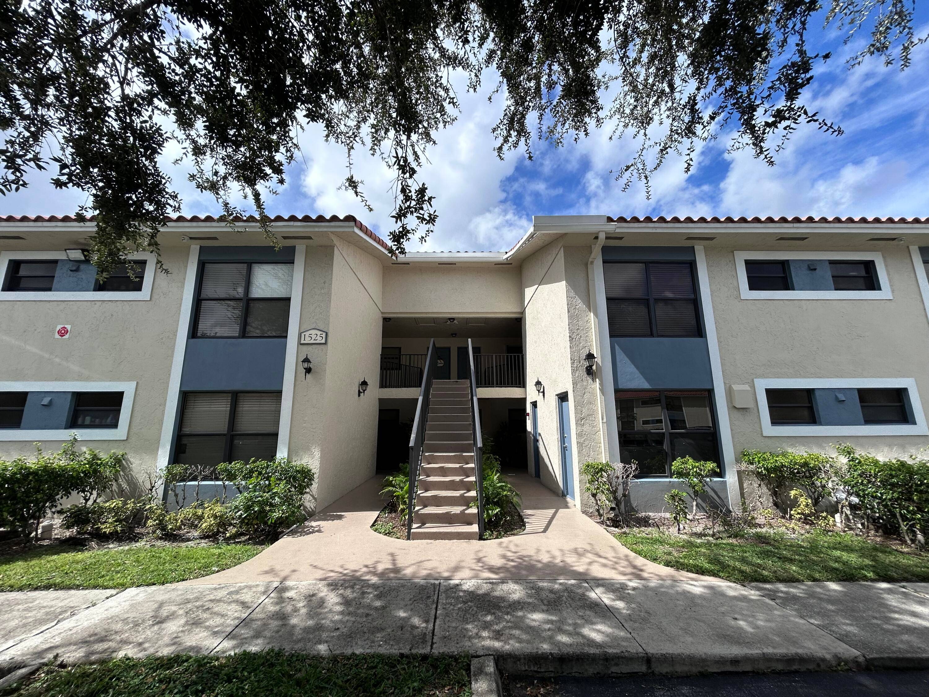 First floor corner unit featuring Water View, ceramic tile in living areas and laminate wood flooring in bedrooms.