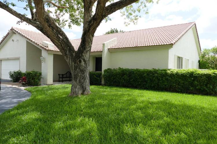 Make your next home in Jacaranda Lakes in this private single family home on a corner lot with a large dome screened pool.
