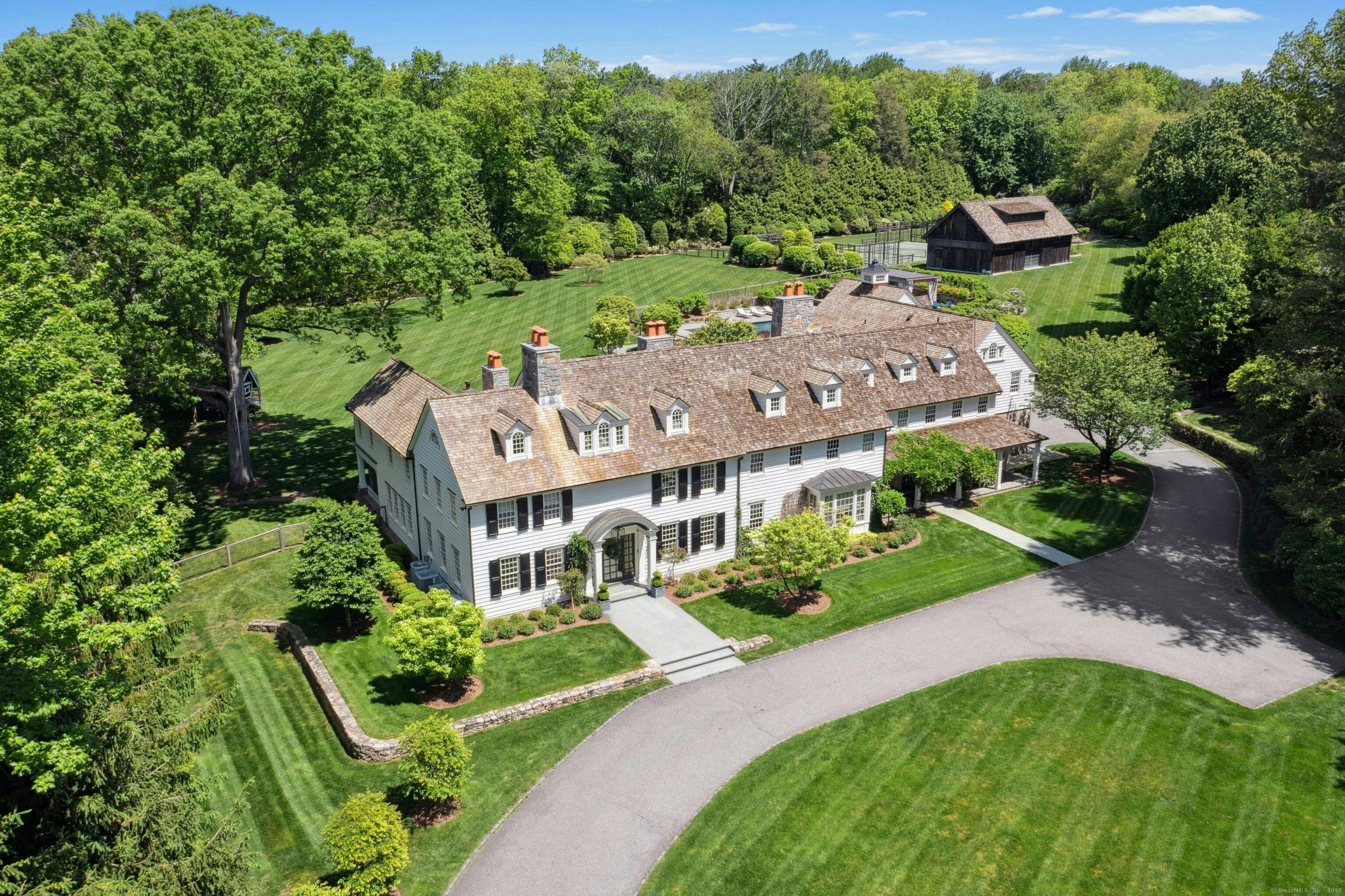 This exquisite 7 bedroom 11 bath residence set on 4.