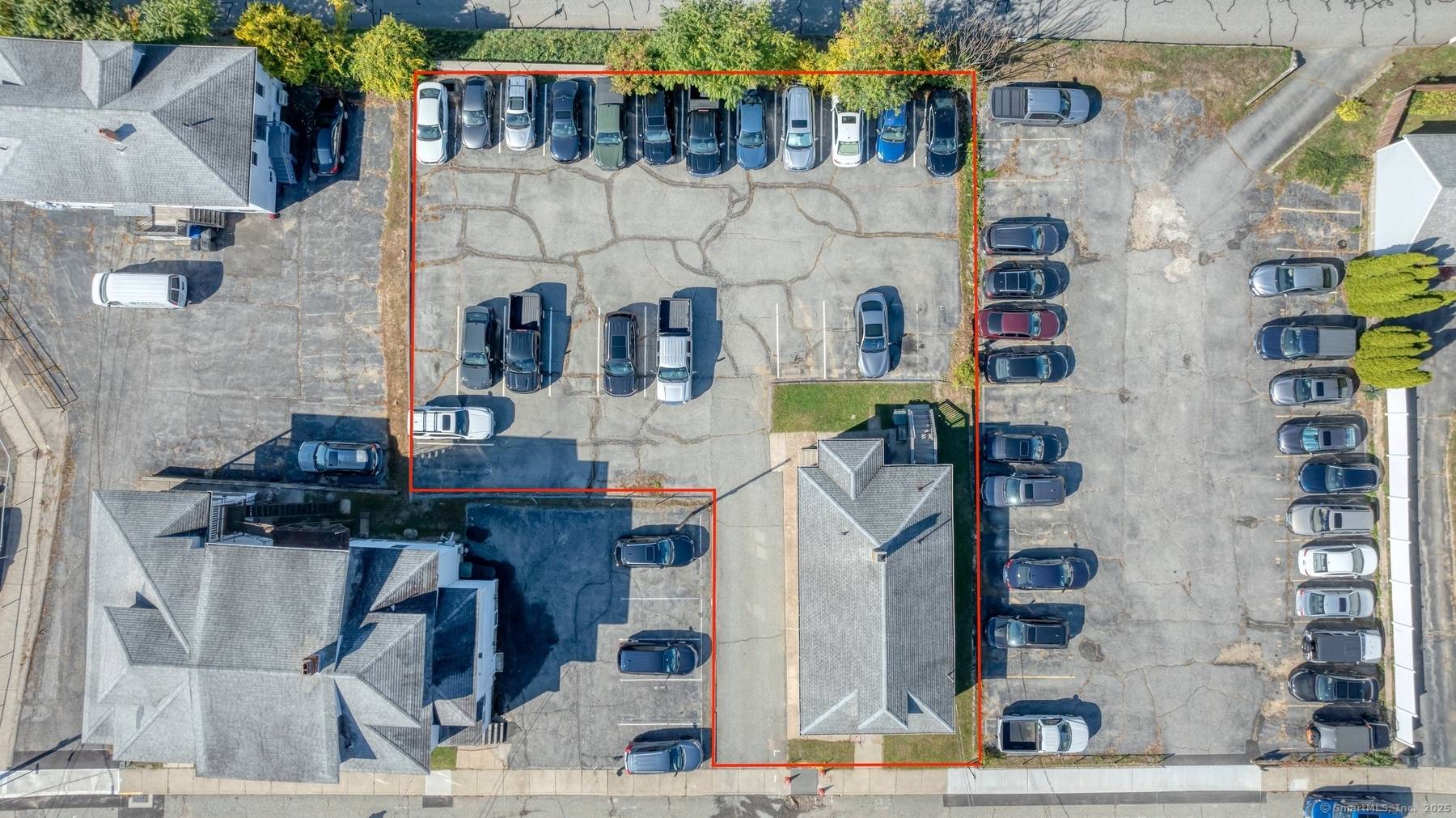 Exceptional multifamily investment opportunity boasting a rare 25 space private parking lot ideally located within walking distance to Electric boat.