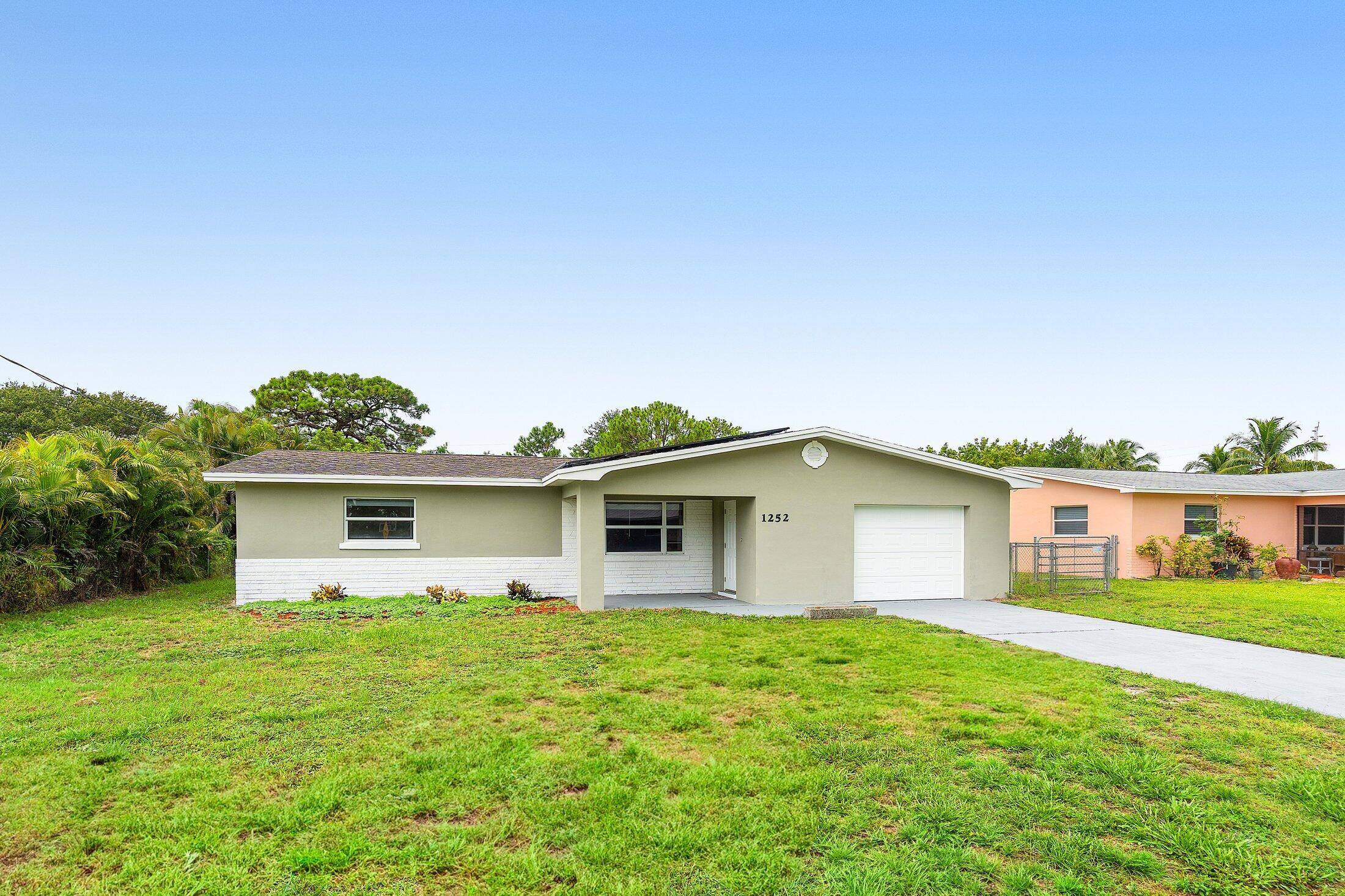 Renovated 2 bedroom, 2 bathroom CBS home in desirable Jensen Beach with a spacious yard.