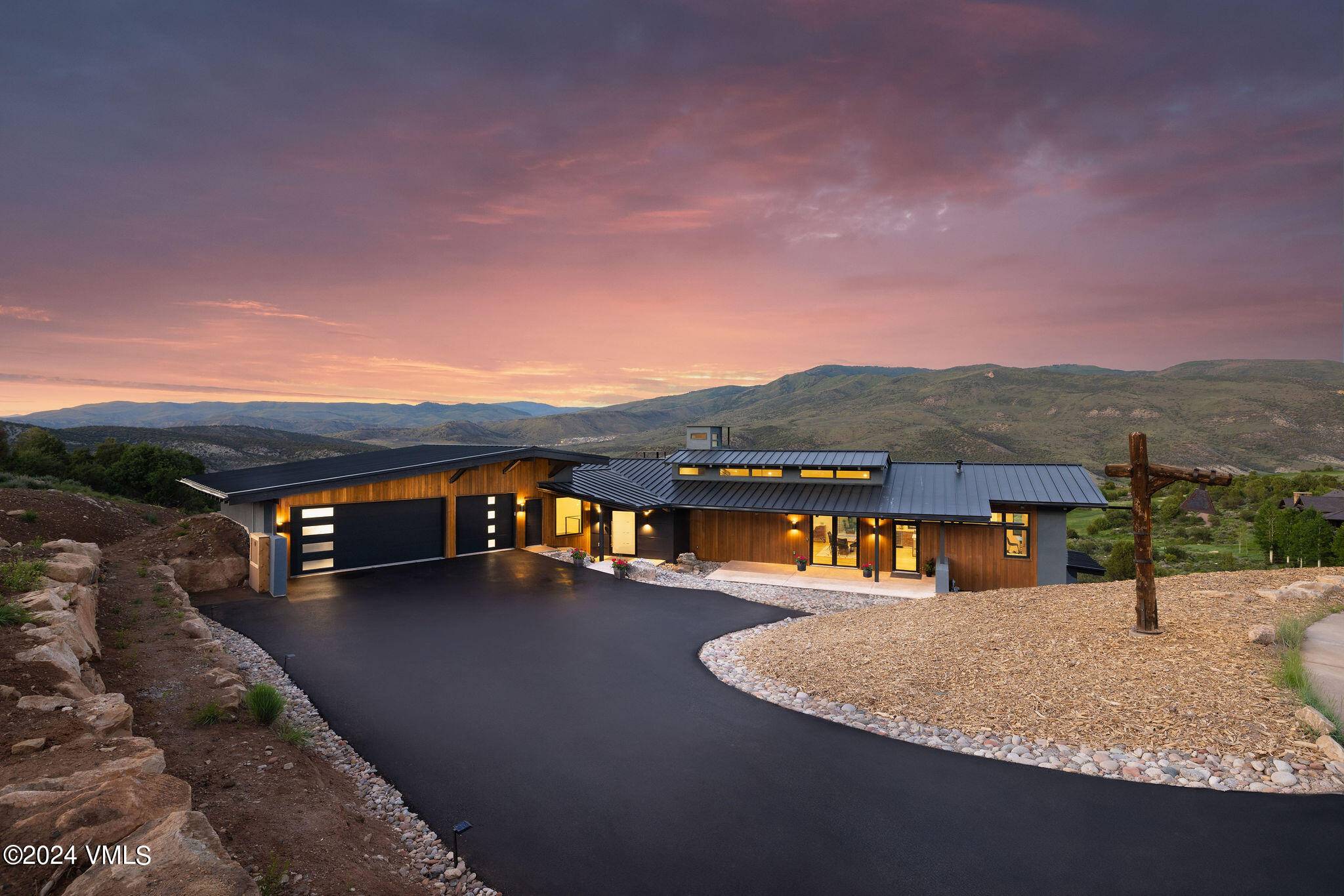 Embrace mountain living with this newly completed custom home in the prestigious Red Sky Ranch golf enclave.