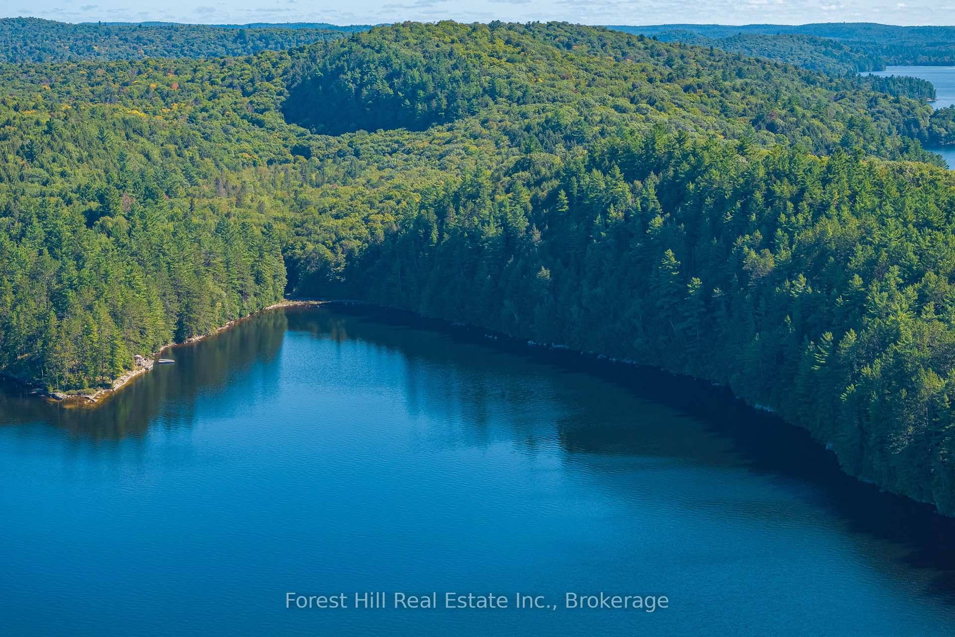 An outstanding, prime vacant building lot with 233 feet of rocky shoreline 1.