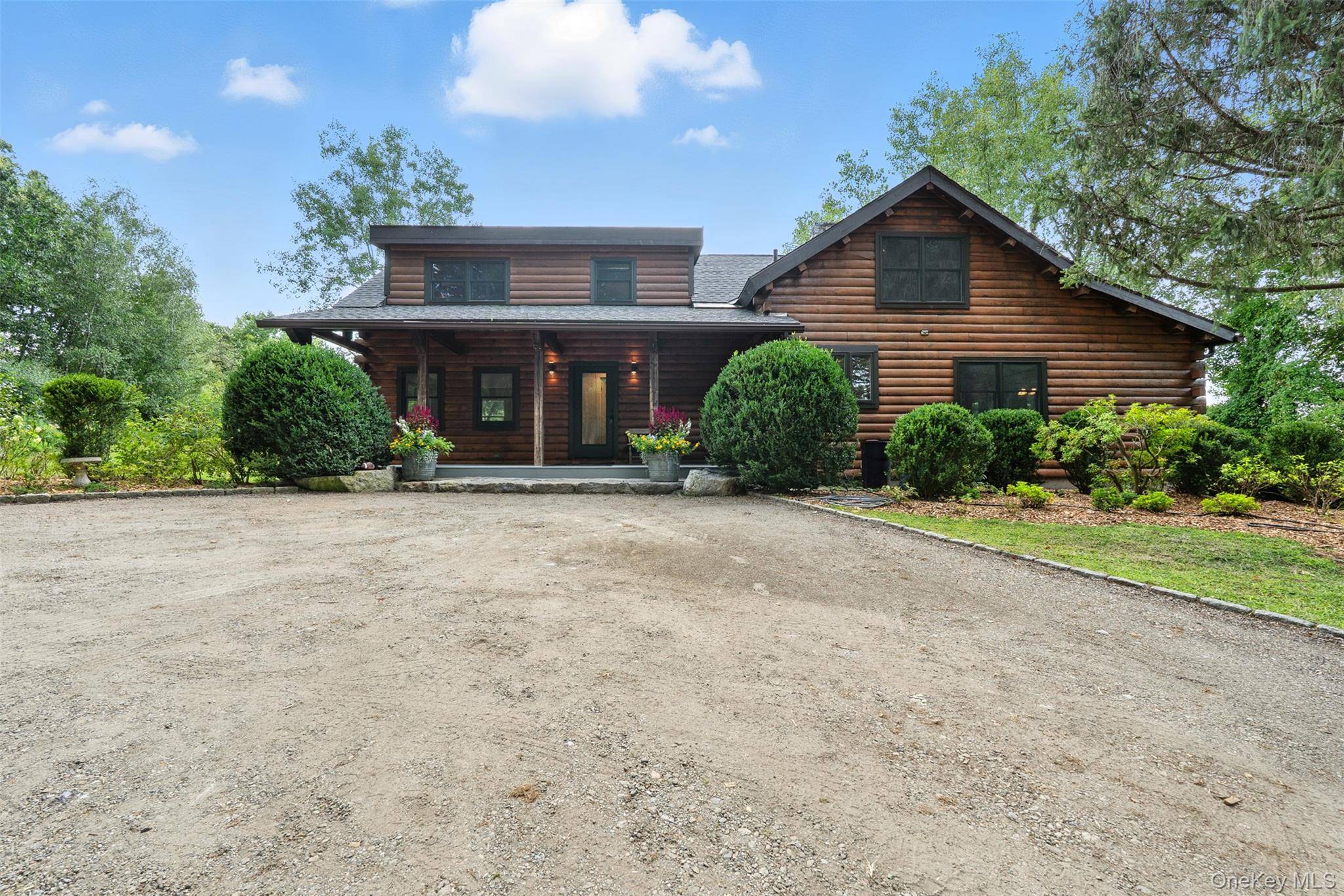 Tucked away in a private and peaceful setting, this beautifully renovated log cabin offers the perfect blend of rustic charm and modern comfort.