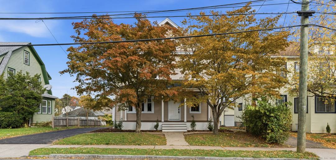 Step into this Beautifully renovated Colonial featuring a stunning kitchen with quartz countertops, custom cabinetry, and stainless steel appliances.