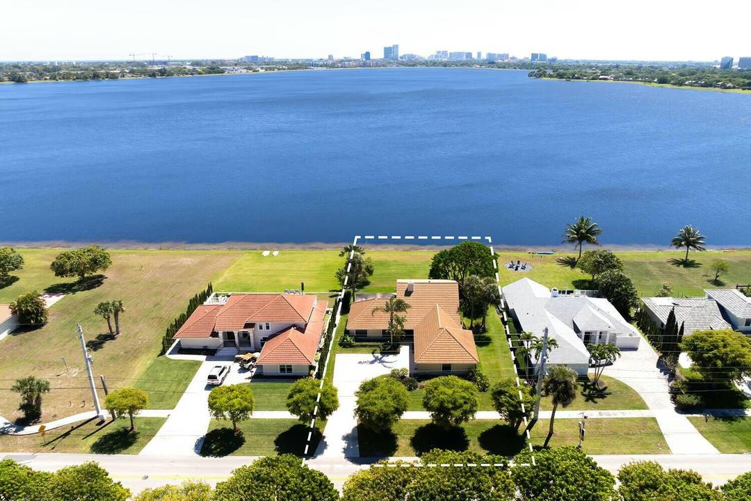 Stunning Downtown WPB City views from this Beautiful 4BR 3BA home on scenic Lake Mangonia.