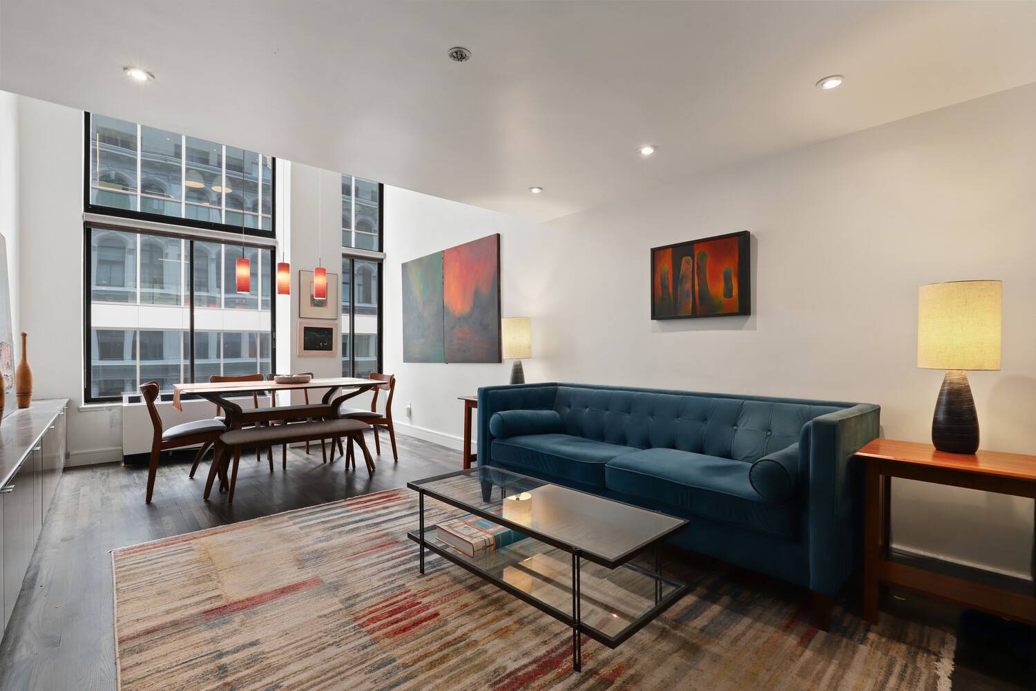 EXCELLENT CONDITION DOUBLE HEIGHT 16 WALL OF WINDOWS Bright, recently renovated duplex loft with 16 Ceiling in Greenwich Village's much sought after historic Cast Iron Building.
