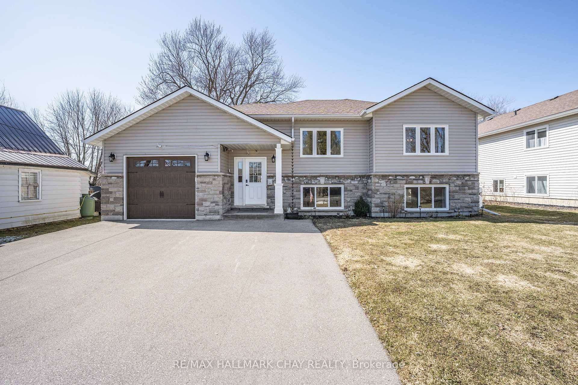 Nestled in the heart of Brechin, this custom built home, crafted with exceptional attention to detail in 2018, offers an inviting atmosphere with spacious, sunlit rooms.
