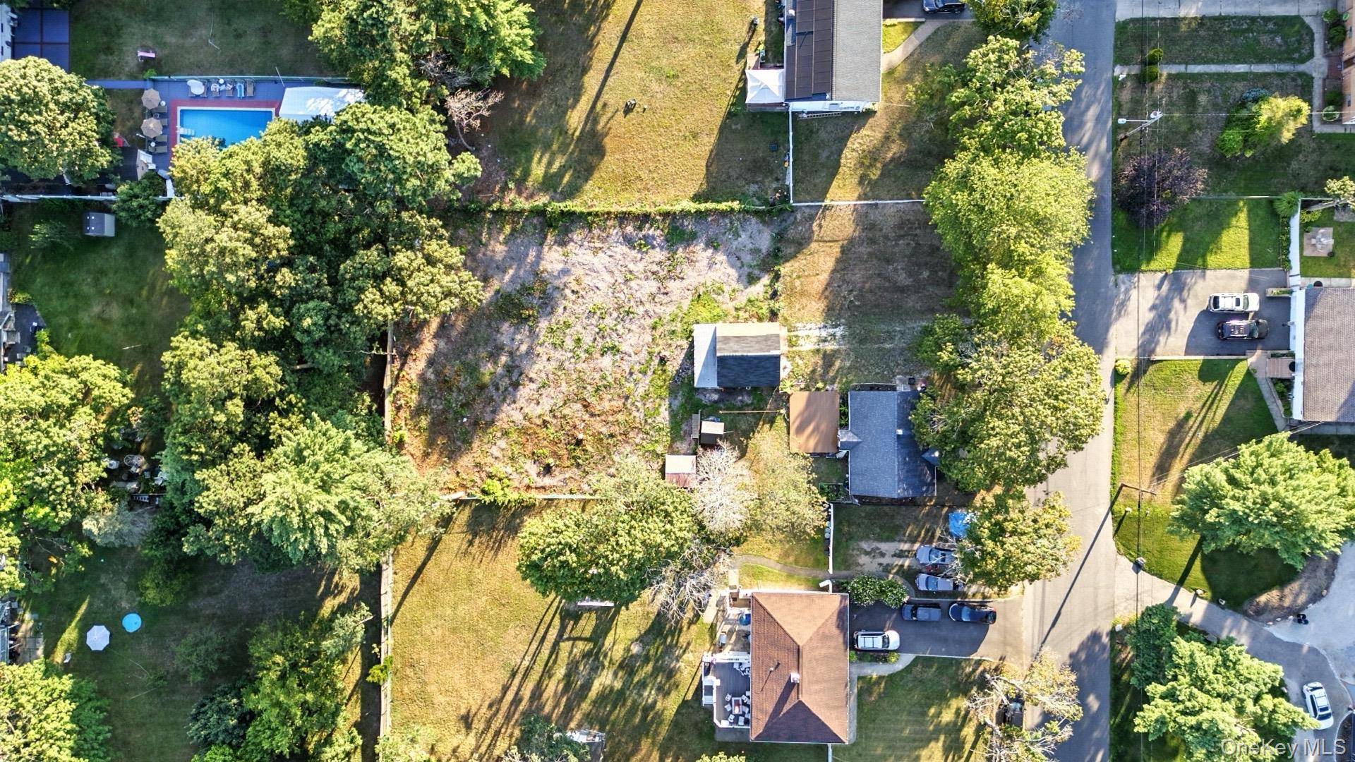 Welcome to this charming home nestled on nearly half an acre, offering the perfect blend of comfort, space, and potential.