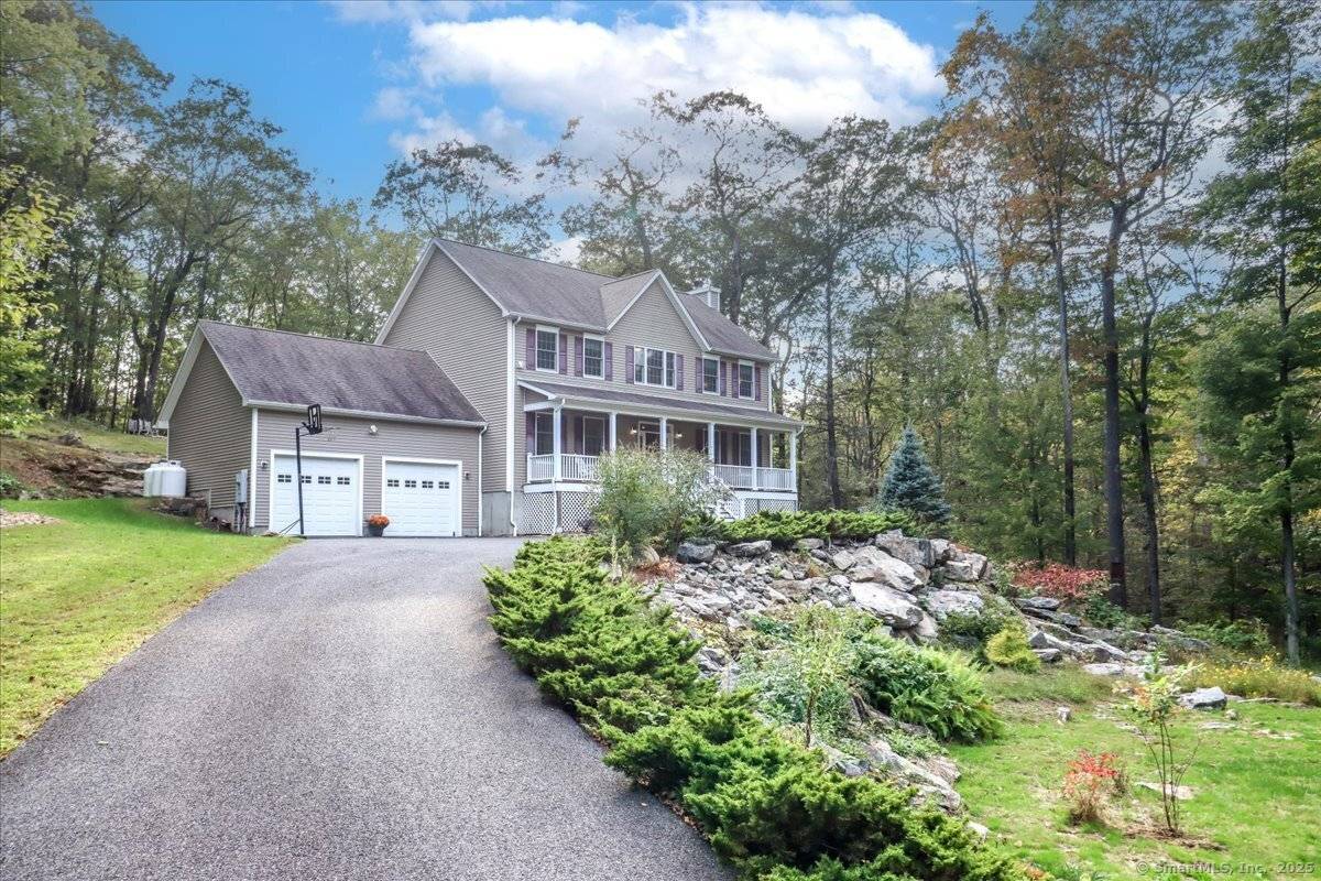 Beautifully maintained 12 year young Colonial Farmhouse set on 2.