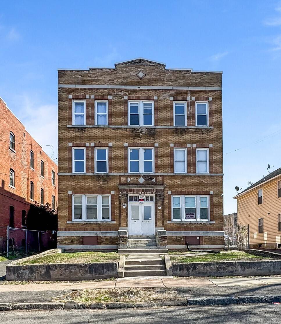 Fully rented brick six family property with off street parking.