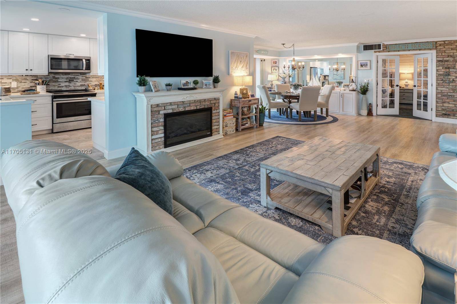 This SW CORNER unit has floor to ceiling windows and doors.