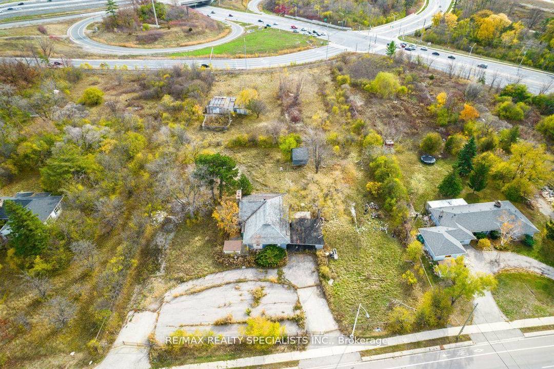 Slightly over 2 Acres development land, Zoned H4 E4 permits for broad variety of uses, has a workshop amp ; house in need of TLC.