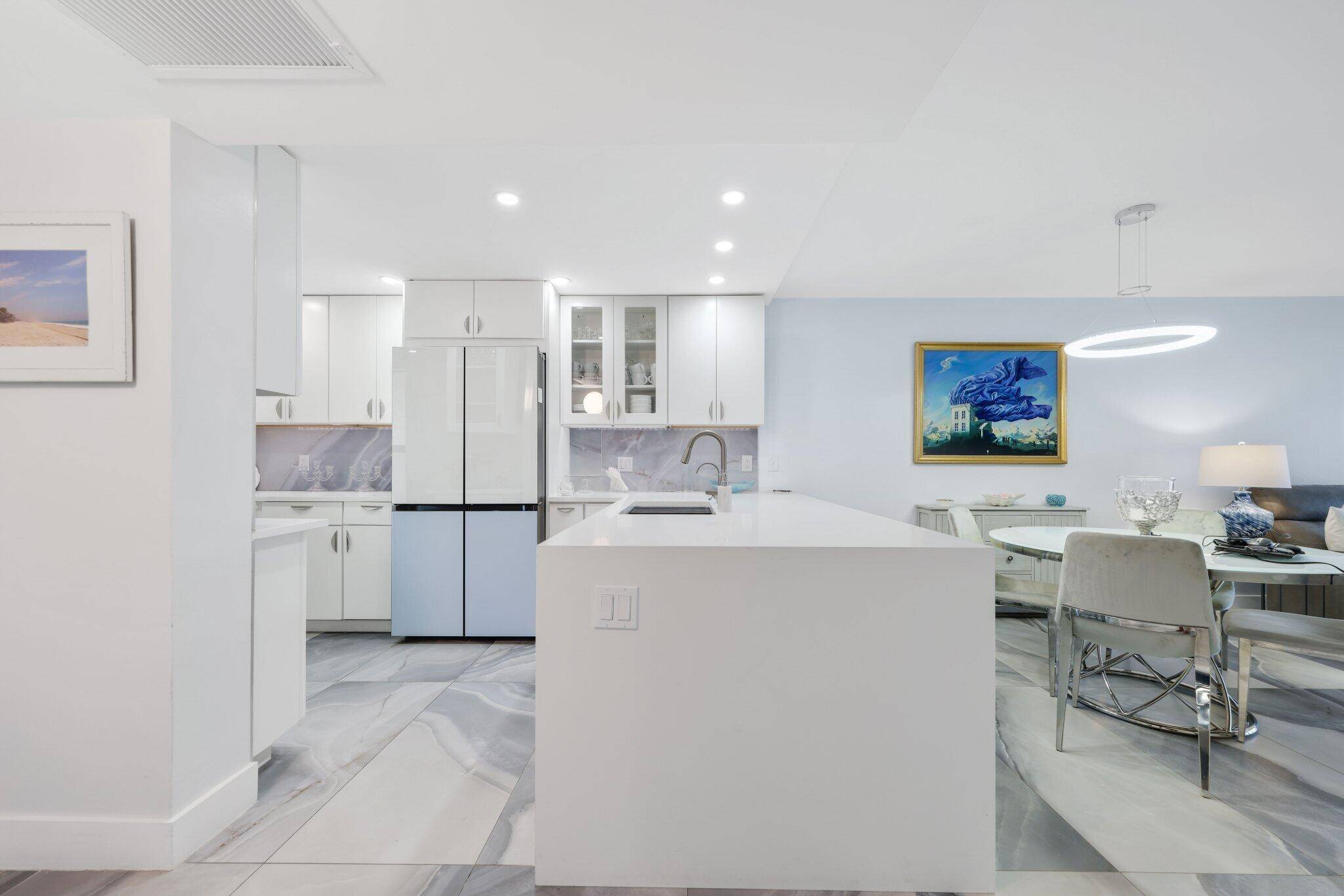 Move in ready and fully furnished, this beautifully renovated waterfront penthouse is located in Boca's coveted Boaters Dream community.