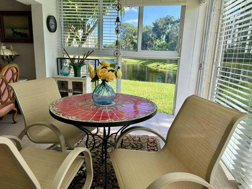 BEAUTIFUL CORNER UNIT WITH EAST EXPOSURE, LAKE, GOLF COURSE, AND POOL VIE.