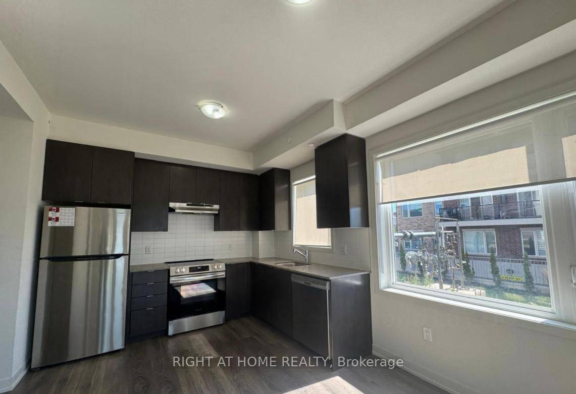 Stunning modern living ground floor corner condo with 2 spacious bedrooms and 2 full washrooms !