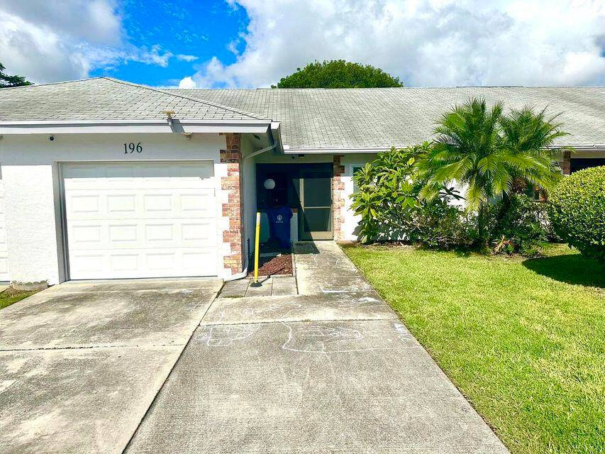 Remodeled townhome with impact windows and sliding door.