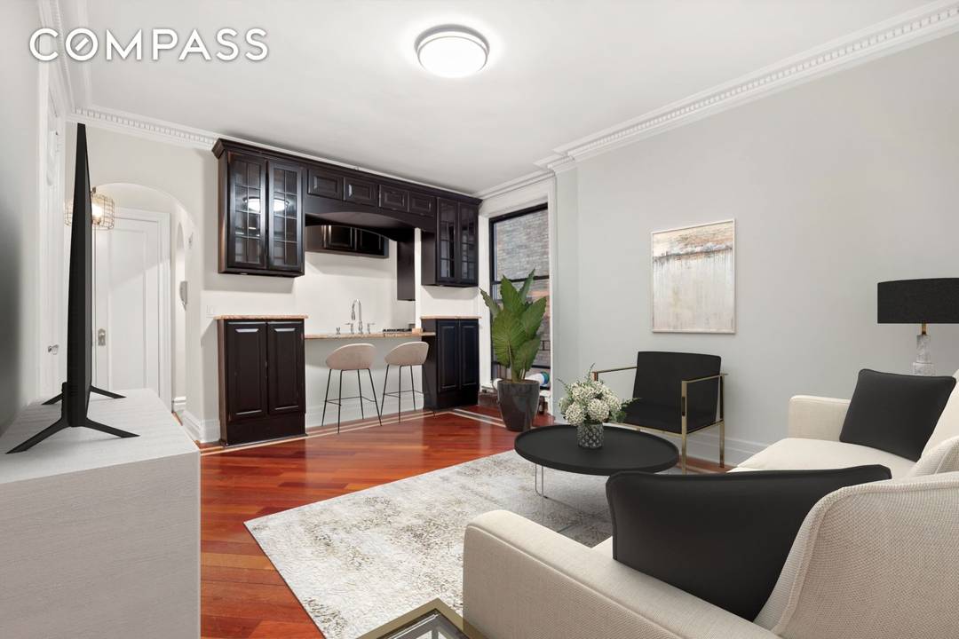Experience timeless elegance in this beautifully renovated one bedroom apartment, where soaring 9 foot ceilings, intricate crown moldings, and rich Brazilian teak hardwood floors create a refined and inviting atmosphere.