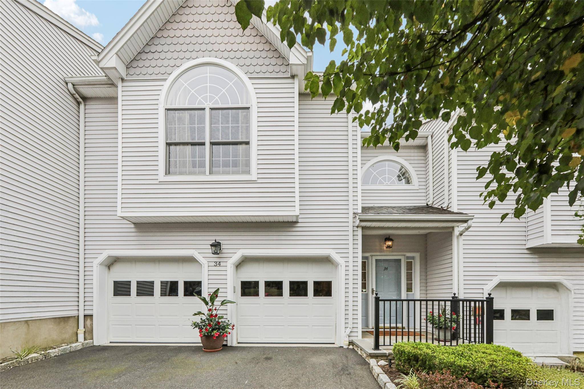 Enjoy a maintenance free lifestyle in this gracious townhome in sought after Forest Ridge.