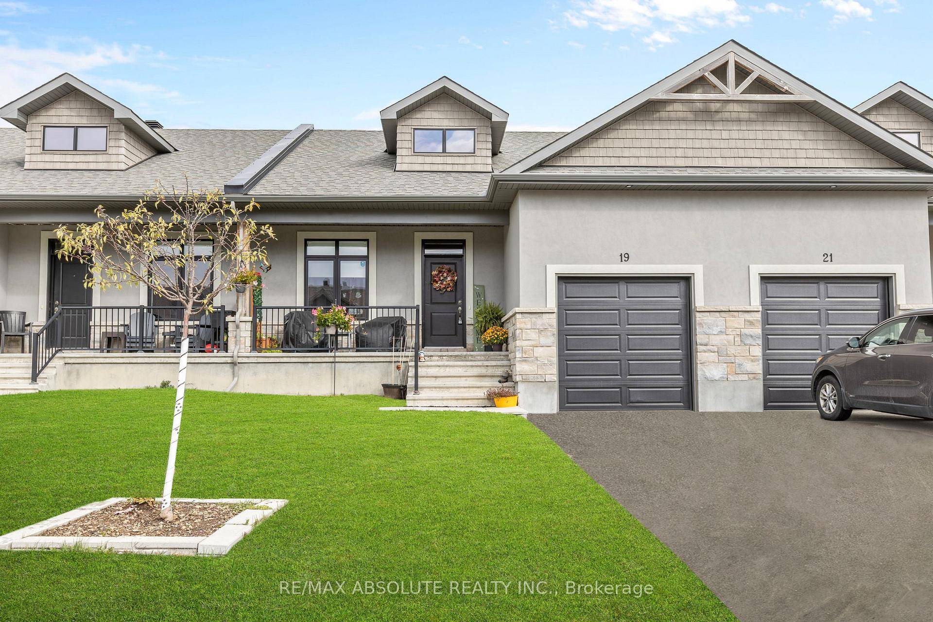 The stone amp ; stucco front no siding amp ; covered front porch provides lots of curb appeal amp ; great afternoon sun !