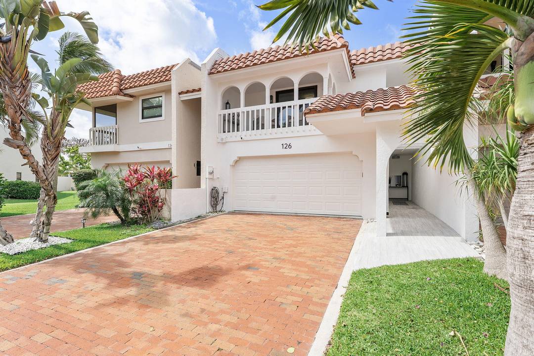 126 Harbor Circle delivers a rare combination a completely renovated home inside a gated waterfront community with a low HOA.