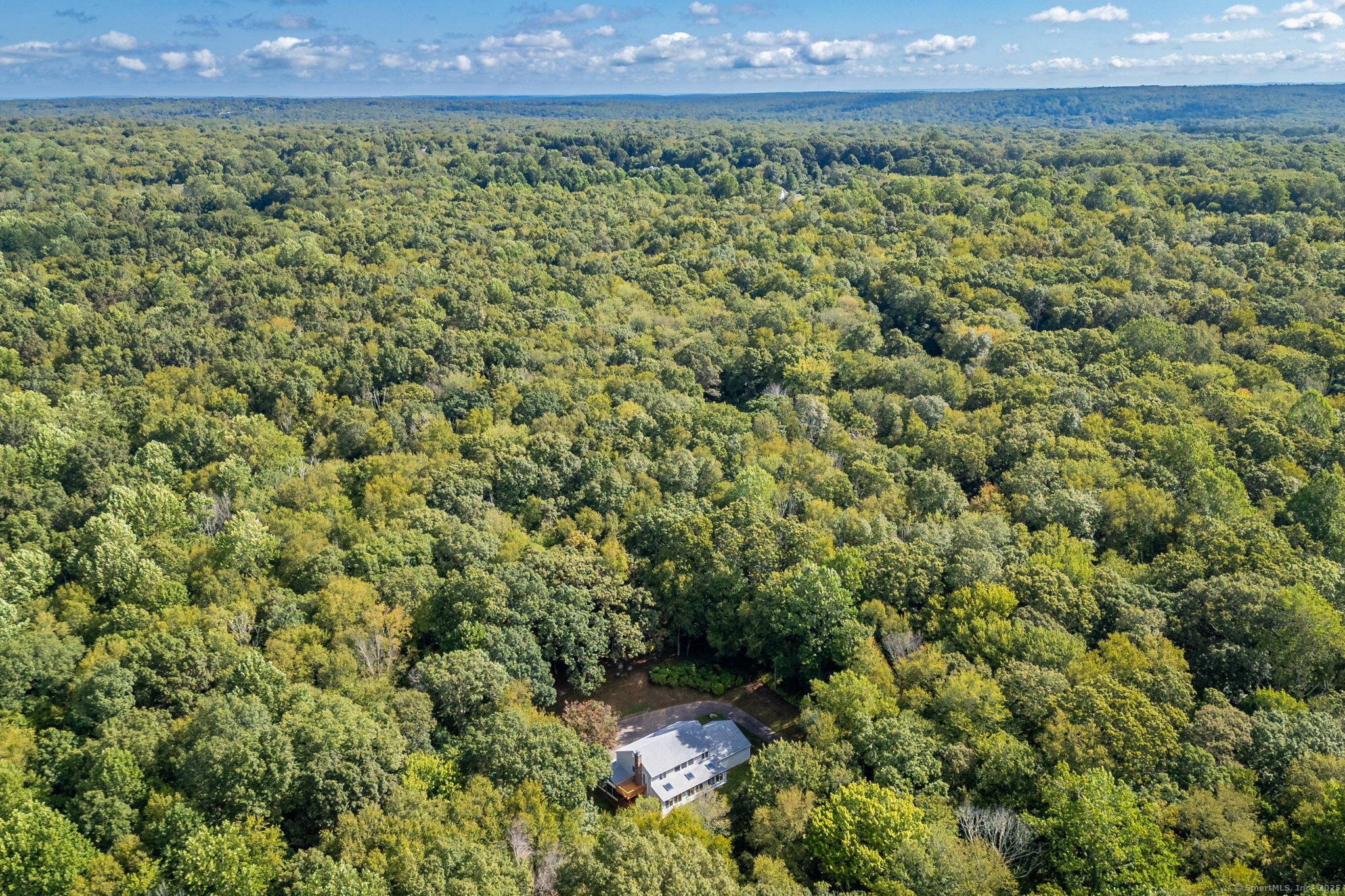 This contemporary home is nestled on 35 acres of private land, offering unmatched peace and tranquility.