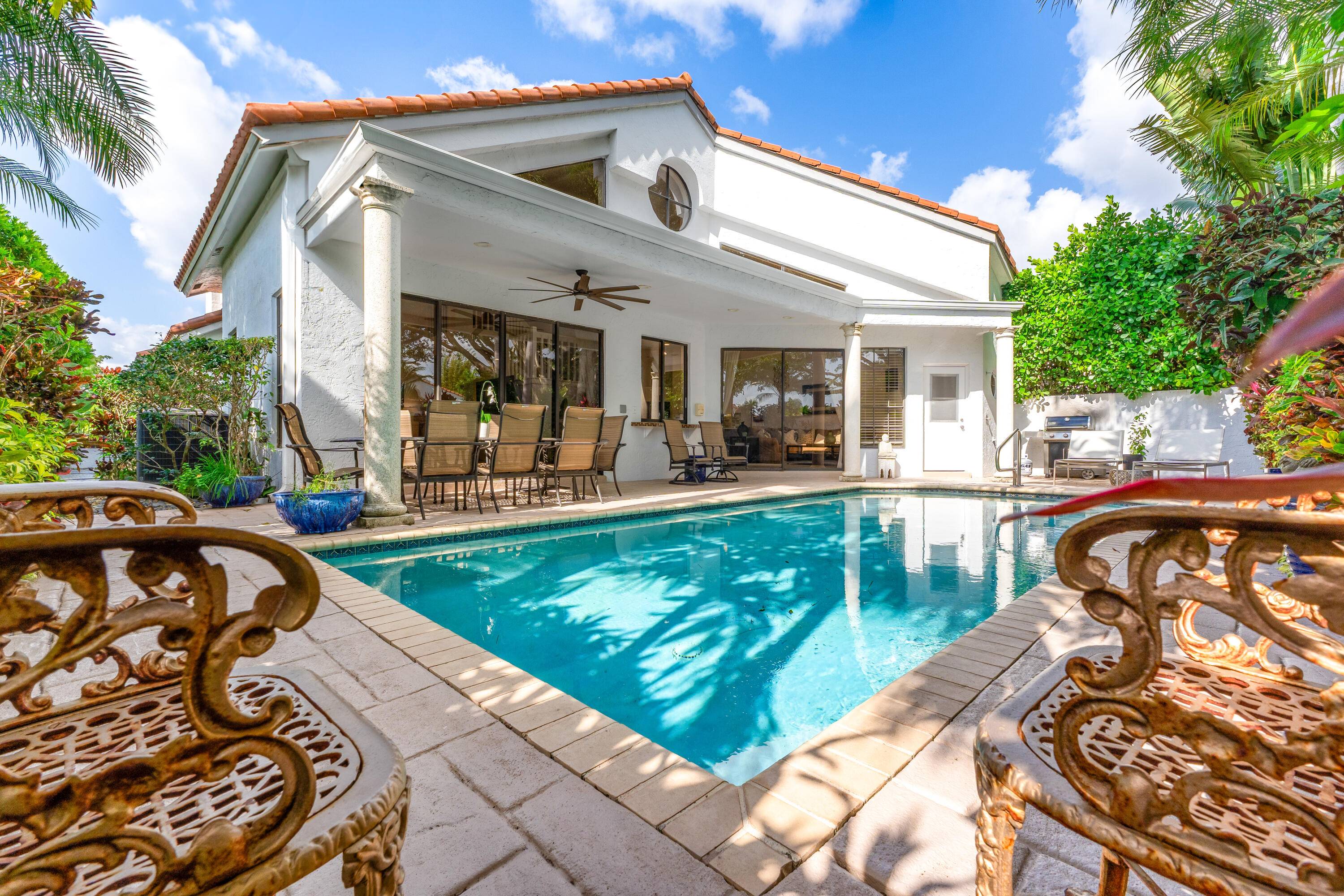 Welcome to your slice of paradise tucked within the prestigious Broken Sound Country Club.