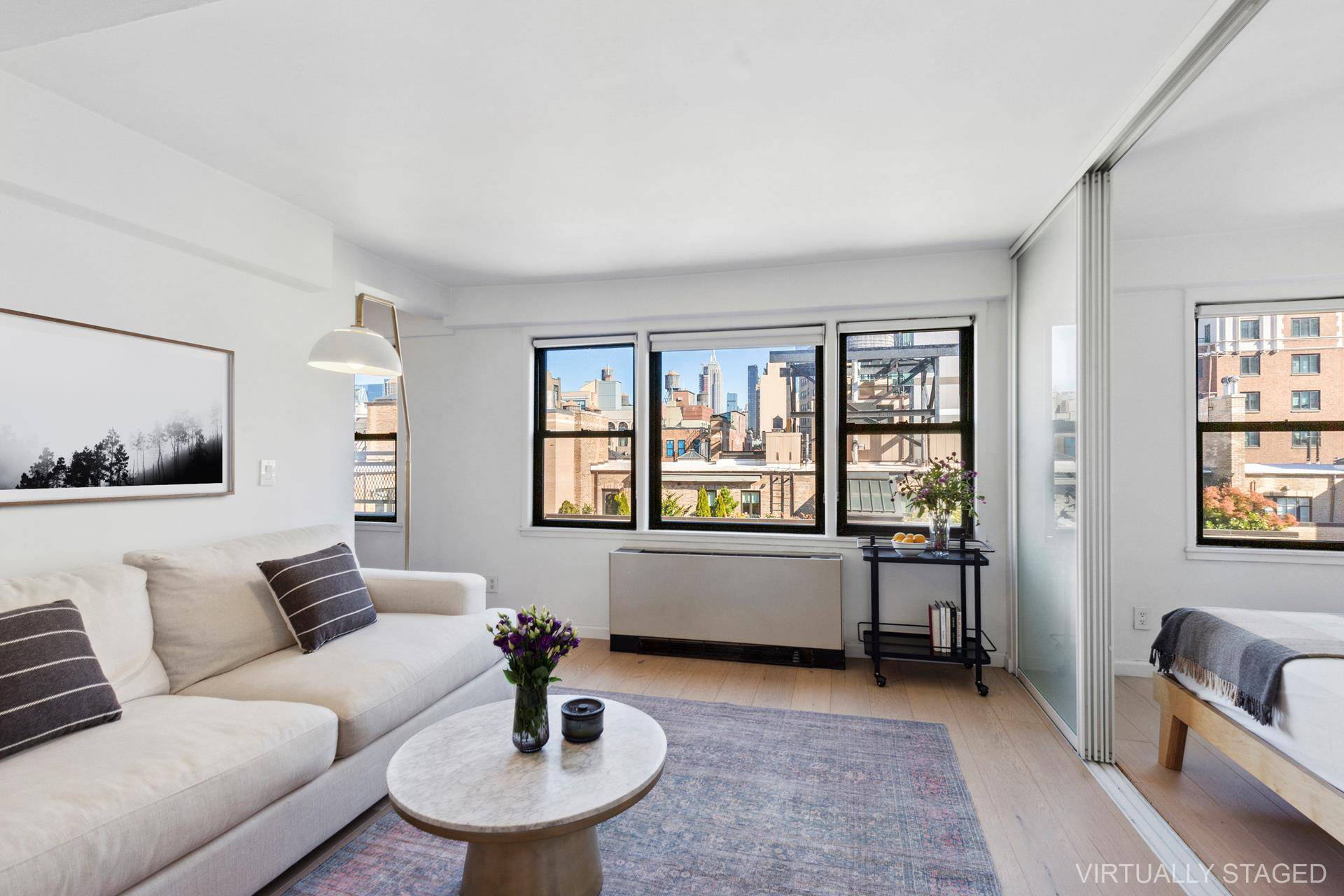 Amazing alcove studio with quintessential views of Greenwich Village rooftops, water towers and The Empire State Building.