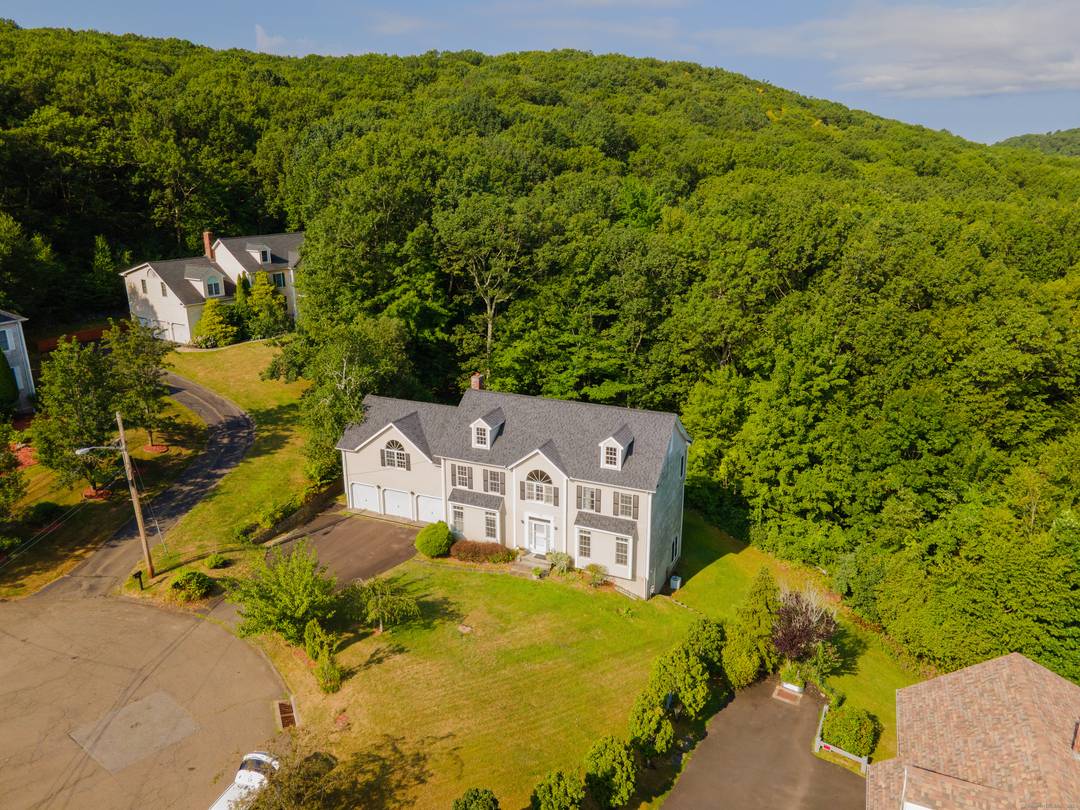 A Private Colonial Retreat in Hamden, CT Tucked away on a serene cul de sac in Mount Carmel, 52 Quarry Lane is an exceptional 5 bedroom, 2.