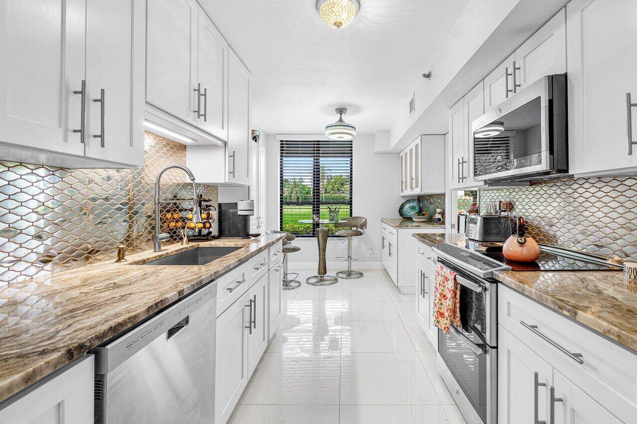 Breathtaking Golf Course and Lake Views Fully Renovated 1st Floor Corner Unit.