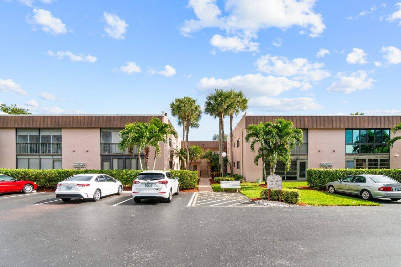 Exquisitely remodeled, this light filled 1st FLOOR condo in the gated Lakes of Delray is a masterpiece of design.