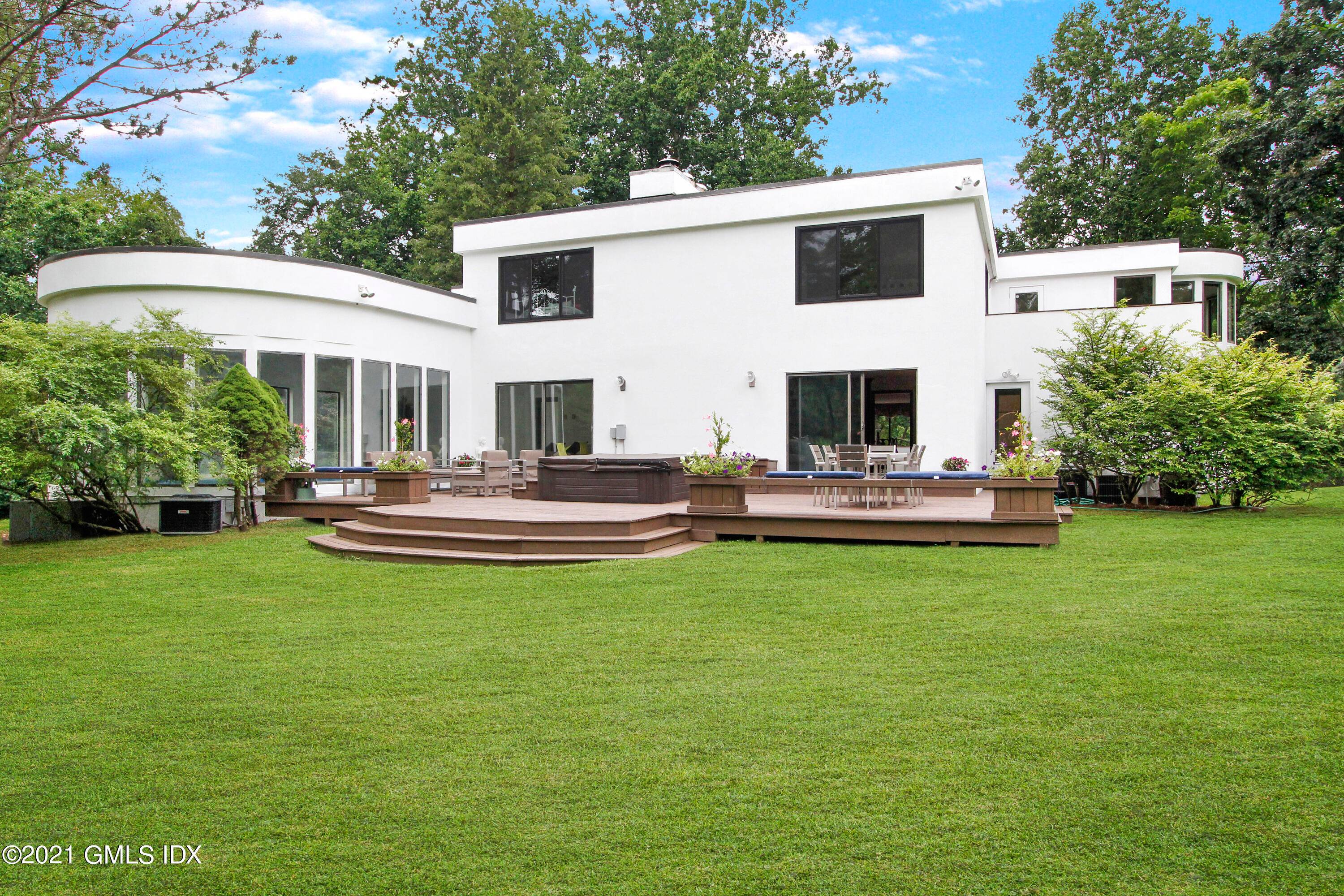 Two extraordinary bronze doors open to an elegant 7, 400 s.