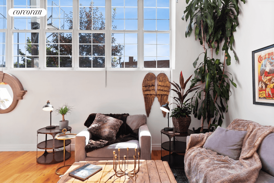 The beauty of these ground floor lofts at the Chocolate Factory is their 17' ceilings allowing for FULL HEIGHT rooms both above and below the loft space.