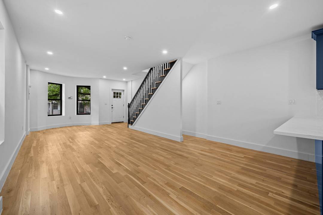 371 Grant Avenue is a fully renovated brick townhouse on a quiet, tree lined street at the Cypress Hills City Line border.
