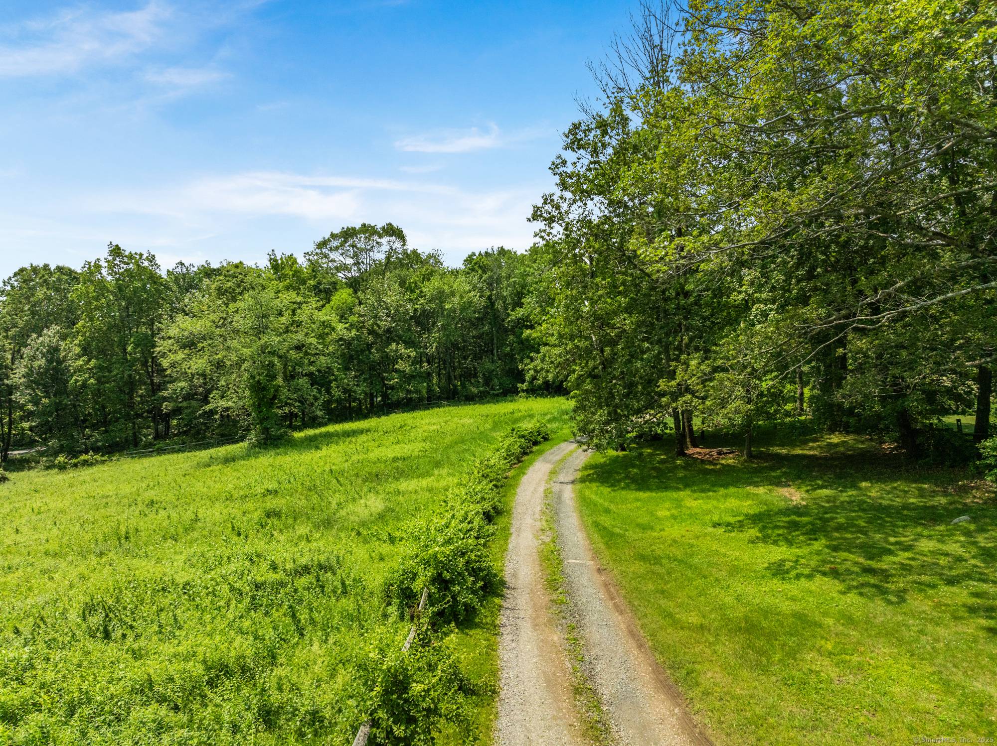 Nearly 75 acres in the hills above Lake Waramaug accessible via scenic country roads.