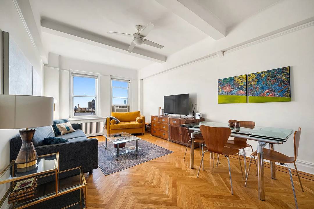 This corner one bedroom apartment sits at the top of a classic, full service Upper West Side prewar coop building and offers open north and east views along with a ...